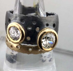 Custom Diamon Ring Blackened with Yellow Gold Bezels and Complementary Yellow Gold Band East Towne Jewelers